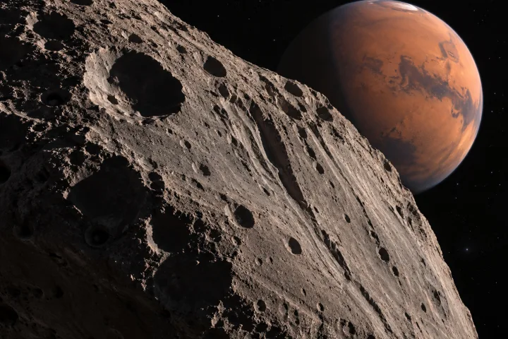 Rappresentazione scientifica di Phobos che si avvicina a Marte e inizia a frantumarsi vicino al limite di Roche